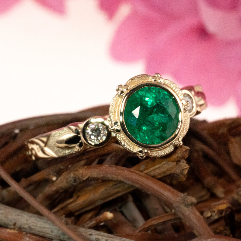 Emerald bezel set flower petal ring