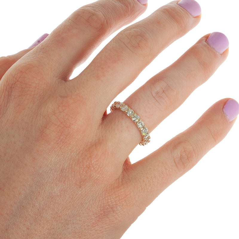 Traditional shared prong diamond ring