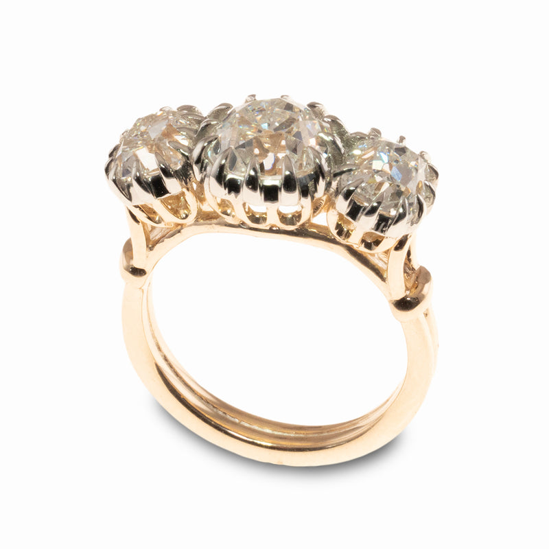 A Georgian Style Engagement Ring with three antique cushion diamonds