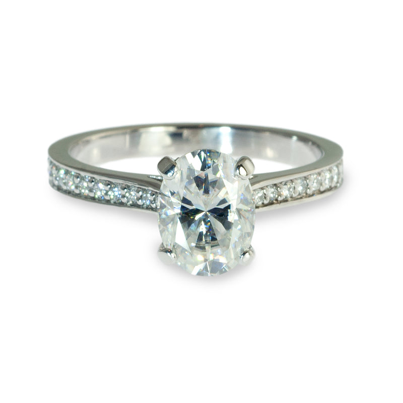 Oval center hidden halo engagement ring