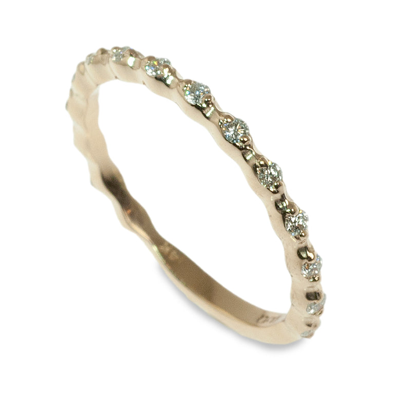 Delicate spaced diamond band