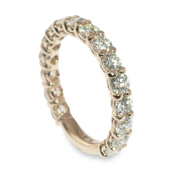 Traditional shared prong diamond ring